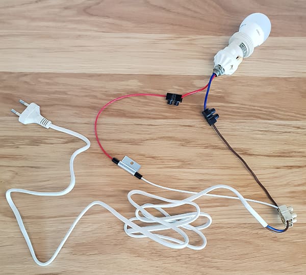 Image of bulb and holder connected to power cord